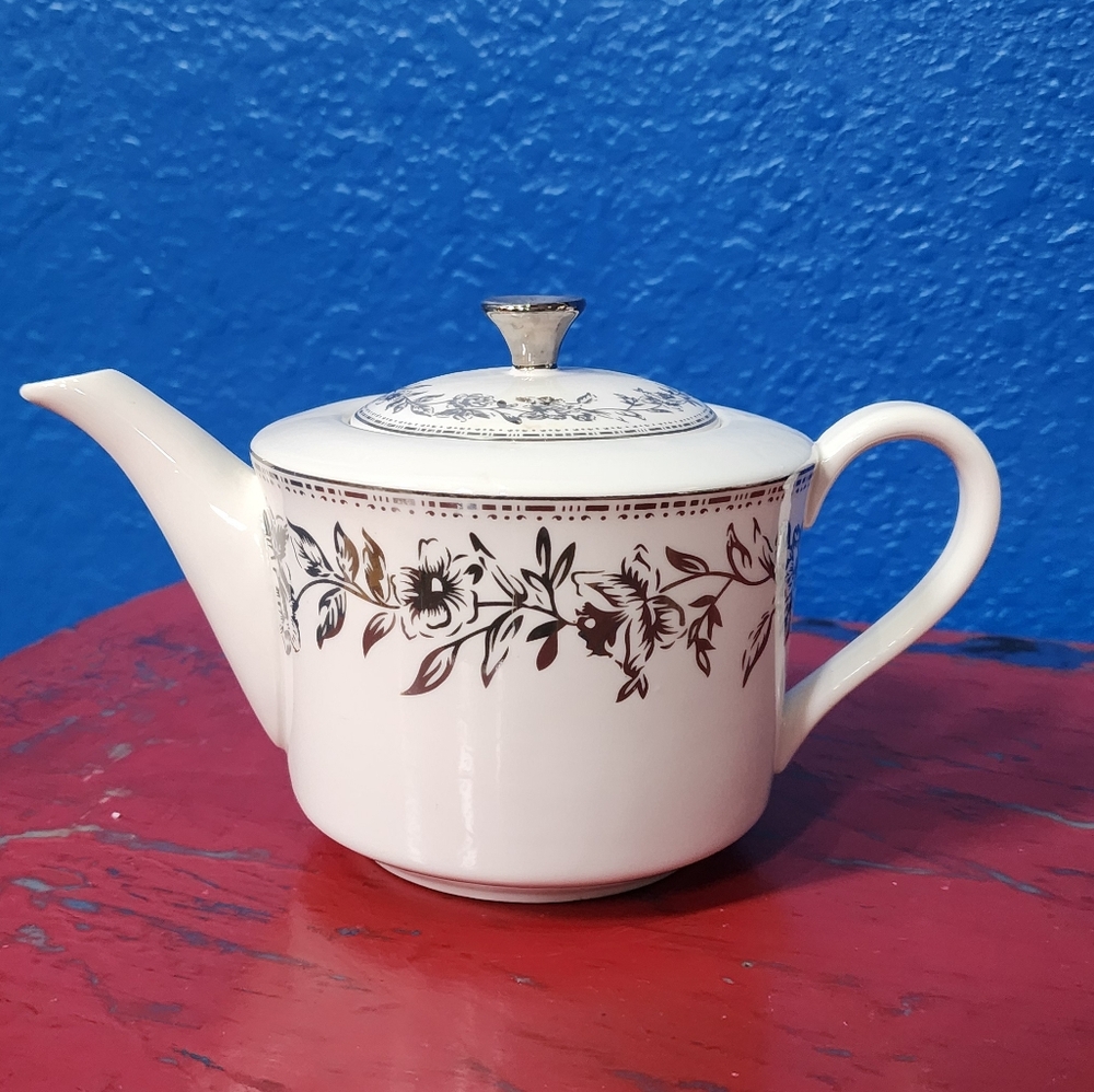 White and silver tea pot